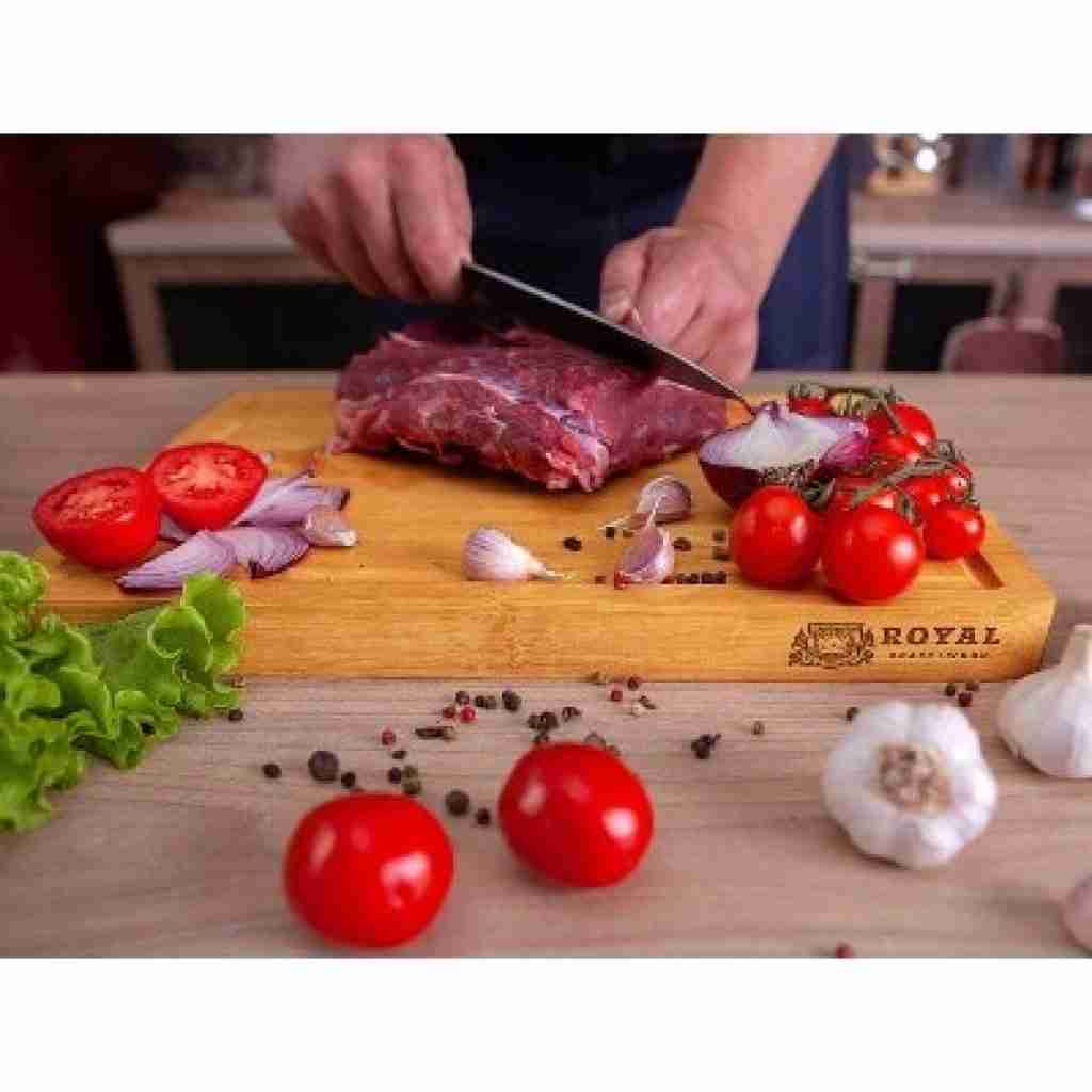 Organic Bamboo Cutting Board with Juice Groove in use