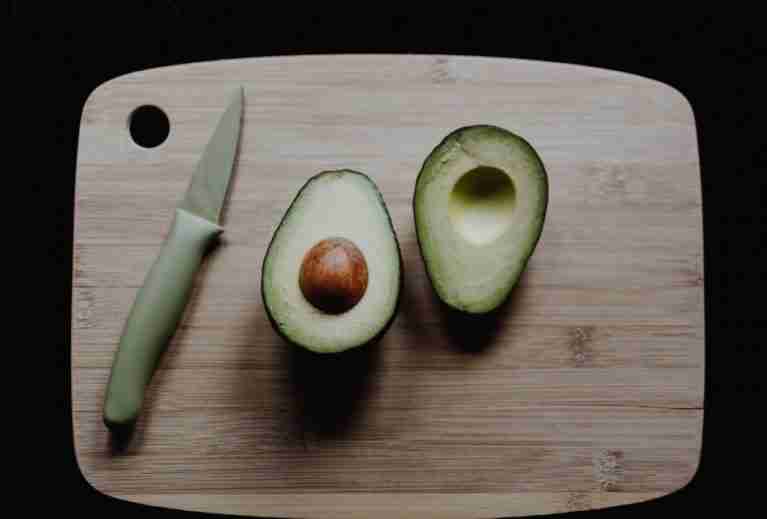 avocado on a bamboo cutting board